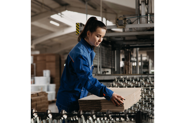 Woman working in paper plant.
